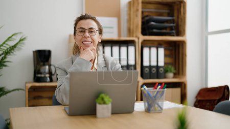 Photo for Middle age hispanic woman business worker using laptop at office - Royalty Free Image