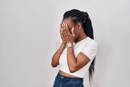 Téléchargez les photos : Beautiful black woman standing over isolated background with sad expression covering face with hands while crying. depression concept. - en image libre de droit