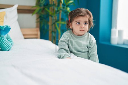 Photo for Adorable hispanic girl standing with relaxed expression at bedroom - Royalty Free Image