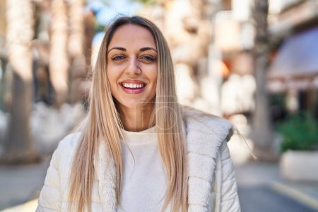 Photo for Young woman smiling confident standing at street - Royalty Free Image