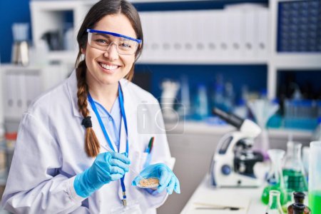 Photo for Young woman scientist working at laboratory - Royalty Free Image