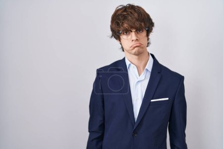 Photo for Hispanic business young man wearing glasses depressed and worry for distress, crying angry and afraid. sad expression. - Royalty Free Image