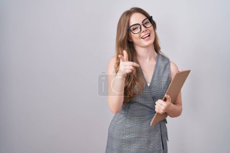 Photo for Caucasian woman wearing glasses and business clothes pointing fingers to camera with happy and funny face. good energy and vibes. - Royalty Free Image