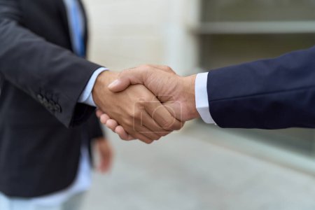 Photo for Two hispanic men business workers shake hands at street - Royalty Free Image