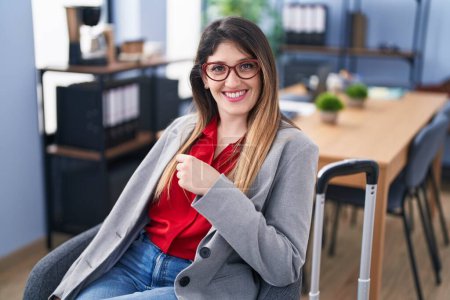 Photo for Young hispanic woman business worker sititng on chair at office - Royalty Free Image