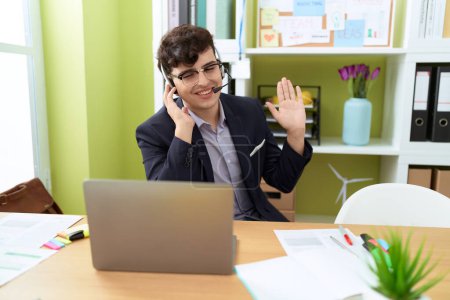 Photo for Non binary man call center agent smiling confident working at office - Royalty Free Image