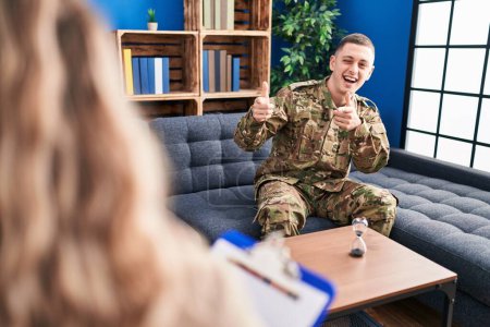 Photo for Young man doing therapy after war pointing fingers to camera with happy and funny face. good energy and vibes. - Royalty Free Image