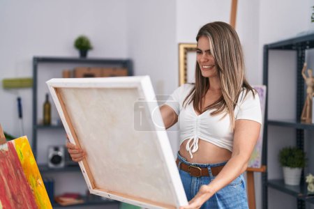 Photo for Young woman artist smiling confident looking draw at art studio - Royalty Free Image