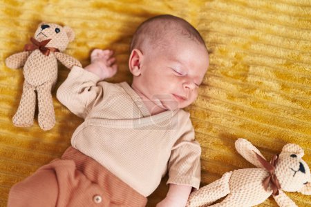 Photo for Adorable caucasian baby lying on bed sleeping at bedroom - Royalty Free Image