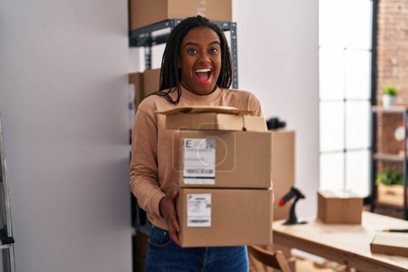 Photo for African american woman packing cardboard box at new home - Royalty Free Image