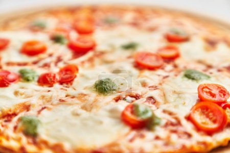 Foto de Delicious plate of caprese italian pizza over isolated white background - Imagen libre de derechos