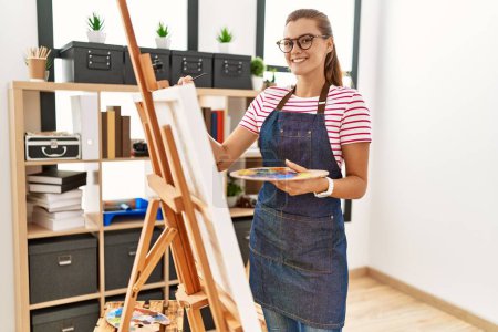 Photo for Young woman smiling confident drawing at art studio - Royalty Free Image