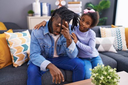 Photo for Father and daughter stressed sitting on so at home - Royalty Free Image