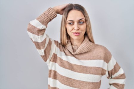Photo for Young blonde woman wearing turtleneck sweater over isolated background confuse and wondering about question. uncertain with doubt, thinking with hand on head. pensive concept. - Royalty Free Image