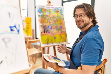 Photo for Middle age caucasian man smiling confident drawing at art studio - Royalty Free Image