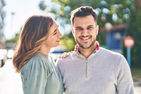 Téléchargez les photos : Man and woman smiling confident hugging each other standing at street - en image libre de droit