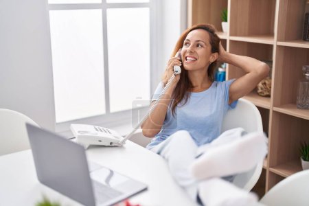 Photo for Young woman smiling confident teleworking at home - Royalty Free Image