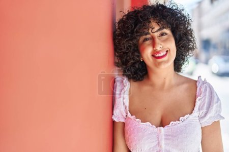 Photo for Young middle east woman smiling confident standing at street - Royalty Free Image