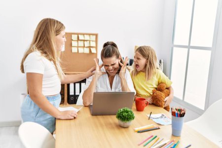 Photo for Mother and daughters business worker stressed for girls working at office - Royalty Free Image