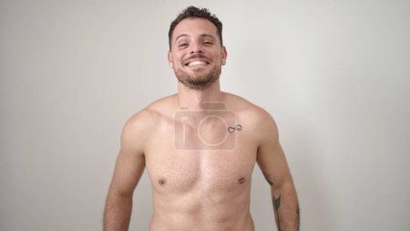 Photo for Young caucasian man standing shirtless smiling over isolated white background - Royalty Free Image