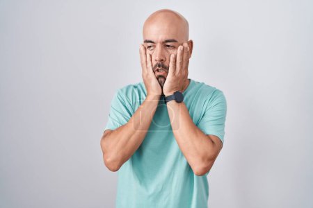 Photo for Middle age bald man standing over white background tired hands covering face, depression and sadness, upset and irritated for problem - Royalty Free Image