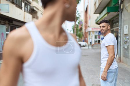 Téléchargez les photos : Two hispanic men couple smiling confident standing together at street - en image libre de droit