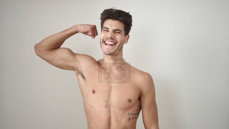 Photo for Young hispanic man smiling confident doing strong gesture with arm over isolated white background - Royalty Free Image