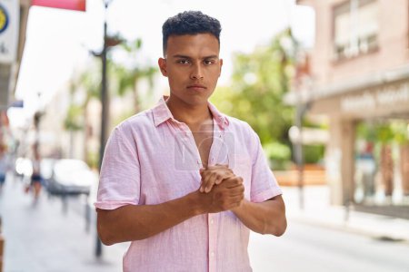 Photo for Young latin man with relaxed expression standing at street - Royalty Free Image