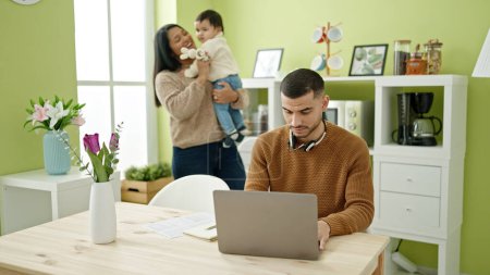 Photo for Couple and son taking care of son working at home - Royalty Free Image