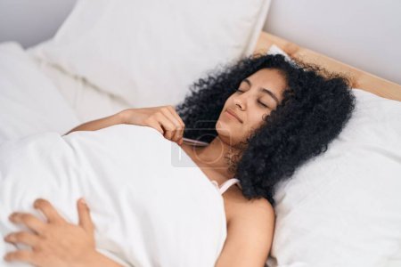 Photo for Young hispanic woman lying on bed sleeping at bedroom - Royalty Free Image