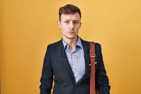 Photo for Caucasian business man over yellow background depressed and worry for distress, crying angry and afraid. sad expression. - Royalty Free Image