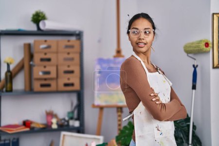 Photo for Young african american woman artist smiling confident standing with arms crossed gesture at art studio - Royalty Free Image