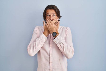 Photo for Handsome middle age man wearing elegant shirt background shocked covering mouth with hands for mistake. secret concept. - Royalty Free Image