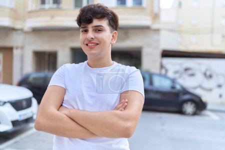 Photo for Non binary man standing with arms crossed gesture at street - Royalty Free Image