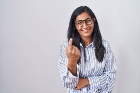Photo for Young hispanic woman wearing glasses beckoning come here gesture with hand inviting welcoming happy and smiling - Royalty Free Image