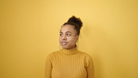 Photo for Young african american woman smiling confident over isolated yellow background - Royalty Free Image