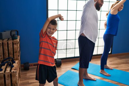 Photo for Family smiling confident stretching at sport center - Royalty Free Image
