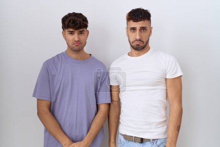 Photo for Homosexual gay couple standing over white background depressed and worry for distress, crying angry and afraid. sad expression. - Royalty Free Image