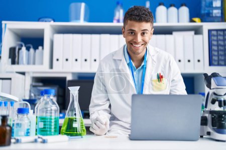 Photo for African american man scientist using laptop working at laboratory - Royalty Free Image