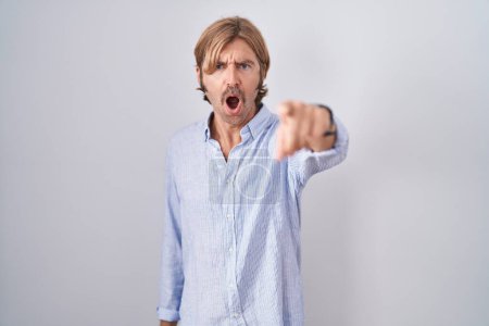 Photo for Caucasian man with mustache standing over white background pointing displeased and frustrated to the camera, angry and furious with you - Royalty Free Image