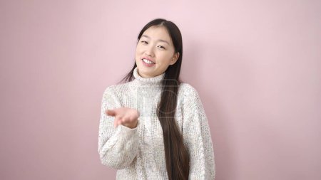 Photo for Young chinese woman smiling confident standing over isolated pink background - Royalty Free Image