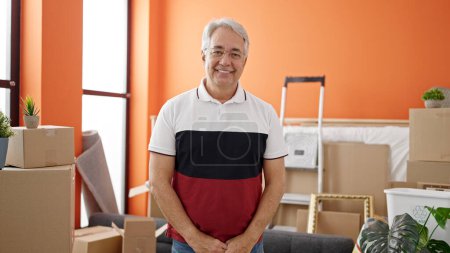 Photo for Middle age man with grey hair smiling confident standing at new home - Royalty Free Image