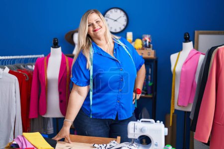 Photo for Young woman tailor smiling confident standing at sewing studio - Royalty Free Image