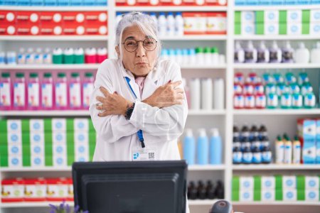 Photo for Middle age woman with tattoos working at pharmacy drugstore shaking and freezing for winter cold with sad and shock expression on face - Royalty Free Image