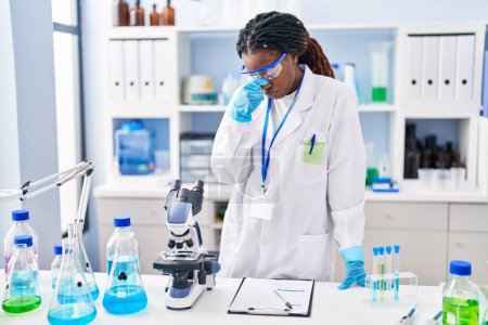 Photo for African american woman scientist stressed standing at laboratory - Royalty Free Image