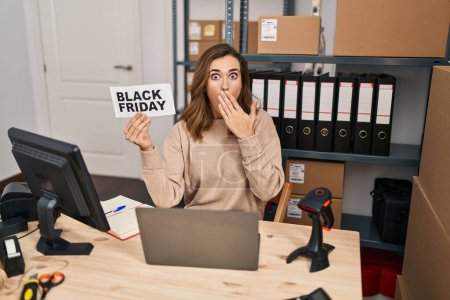 Photo for Young beautiful woman holding black friday banner small commerce covering mouth with hand, shocked and afraid for mistake. surprised expression - Royalty Free Image