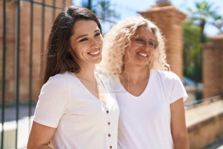 Photo for Two women mother and daughter standing together at street - Royalty Free Image