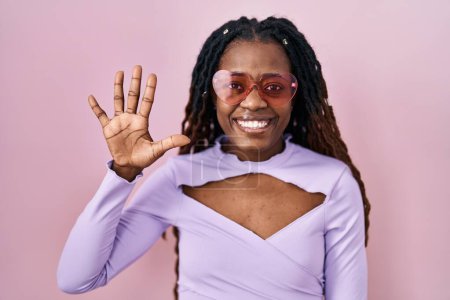 Photo for African woman with braided hair standing over pink background showing and pointing up with fingers number five while smiling confident and happy. - Royalty Free Image