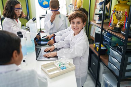 Photo for Group of kids scientists students using laptop at laboratory classroom - Royalty Free Image