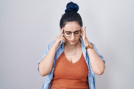 Photo for Young modern girl with blue hair standing over white background with hand on head, headache because stress. suffering migraine. - Royalty Free Image